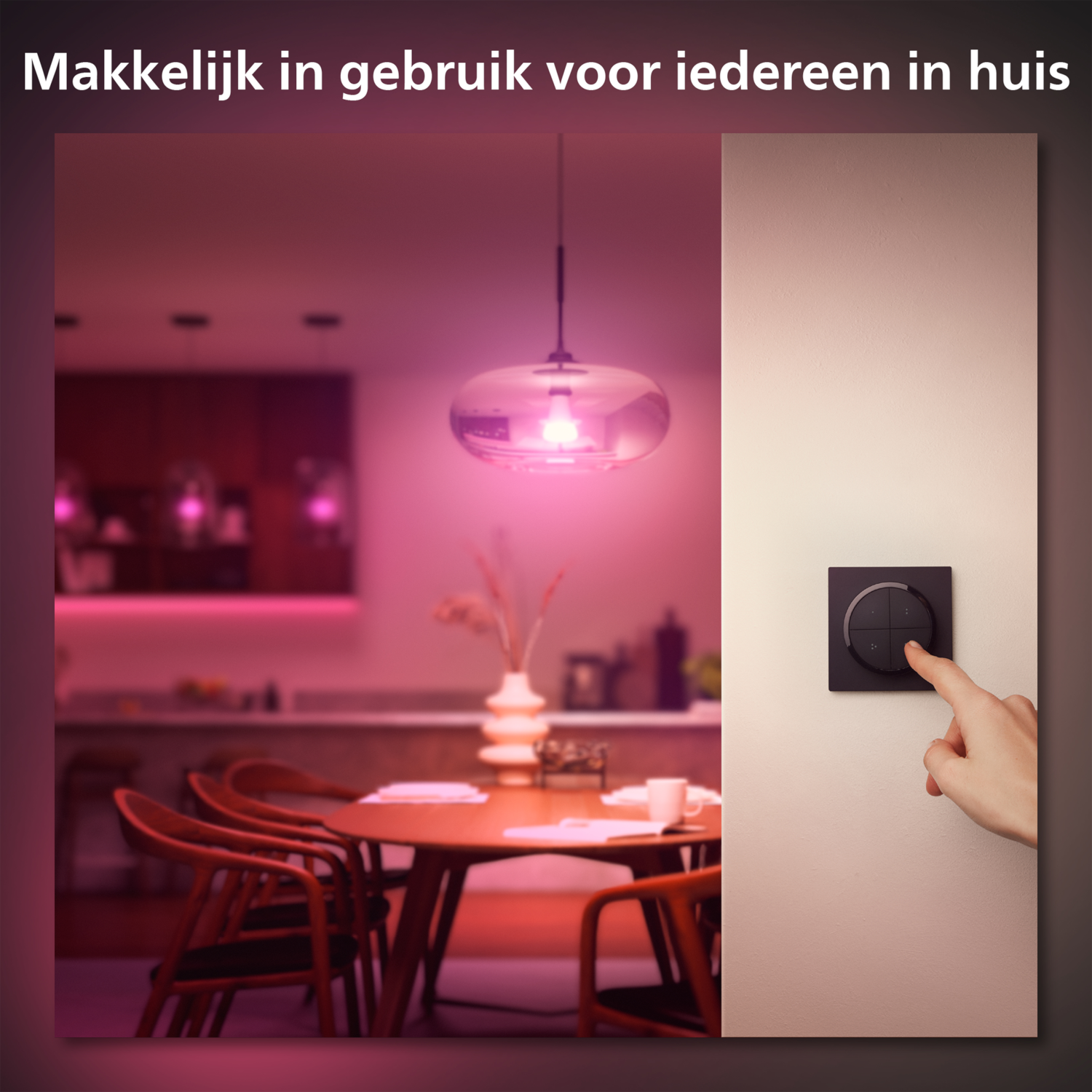 A hand turns on a black wall switch with a circular button. A lamp above illuminates the room in pink.