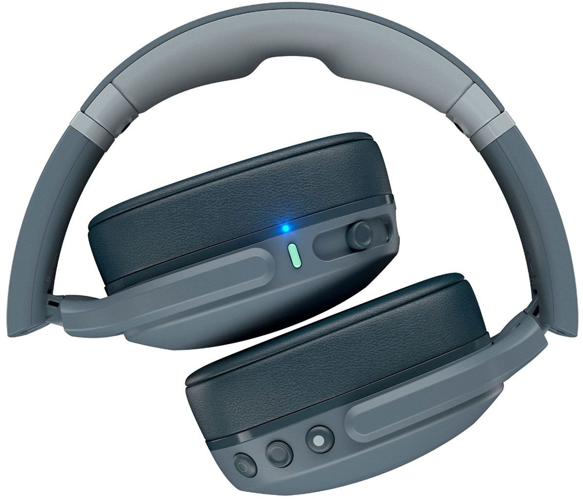 Folded grey and navy blue headphones, with a power button and volume controls visible.