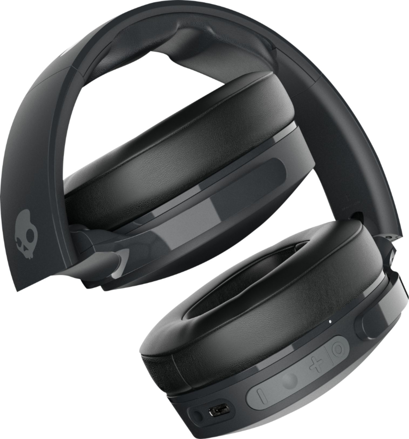 Casque pliable noir. Logo Skullcandy visible. Fond noir.