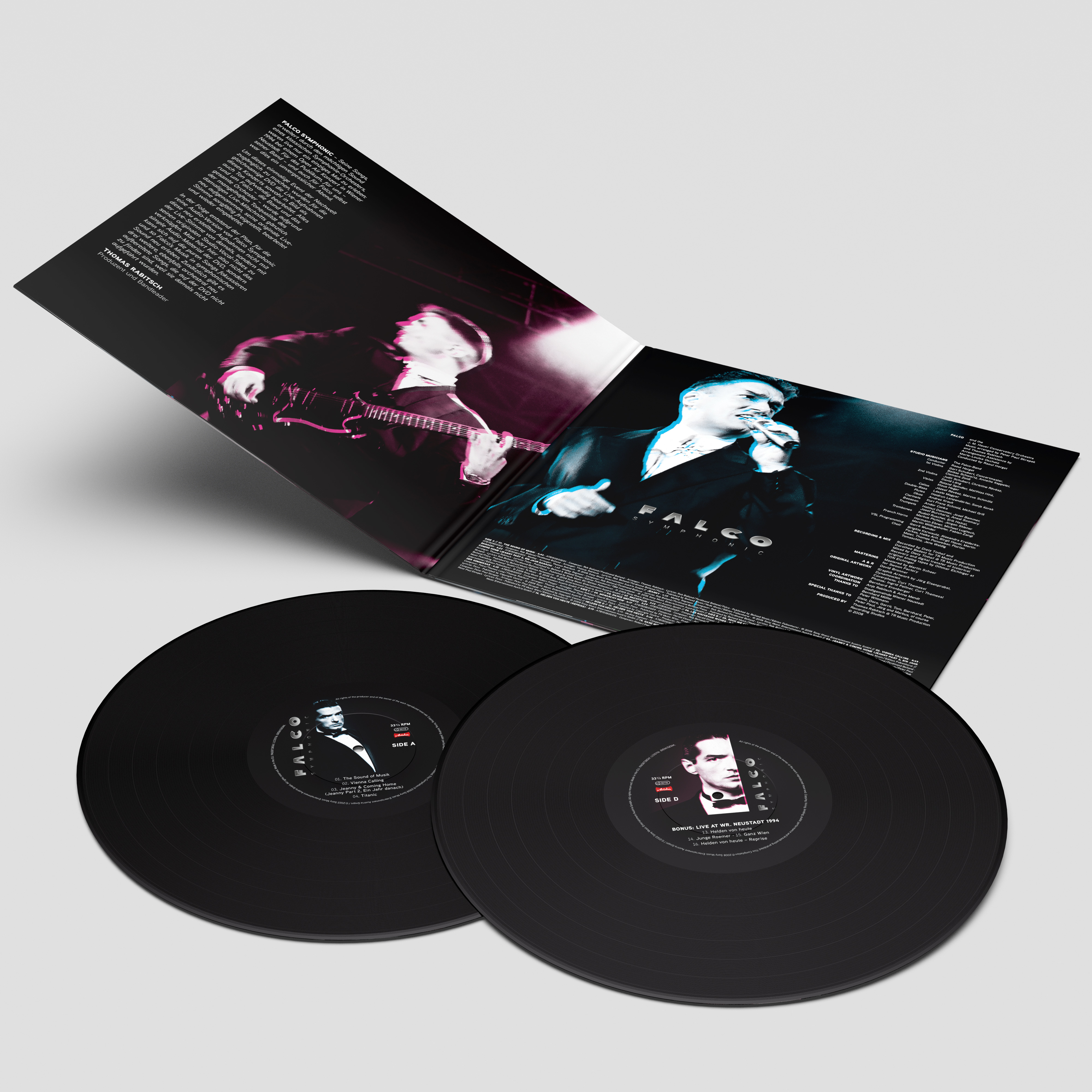 Zwei schwarze Schallplatten mit Albumcover und Text, offene Albumhülle.