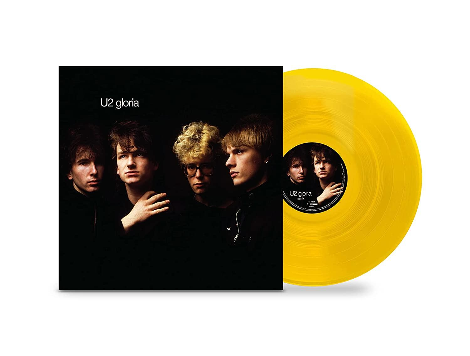 U2-Albumcover. Die Bandmitglieder sind in einem Schwarz-Weiß-Foto zu sehen. Eine gelbe Vinyl-Schallplatte wird gezeigt.
