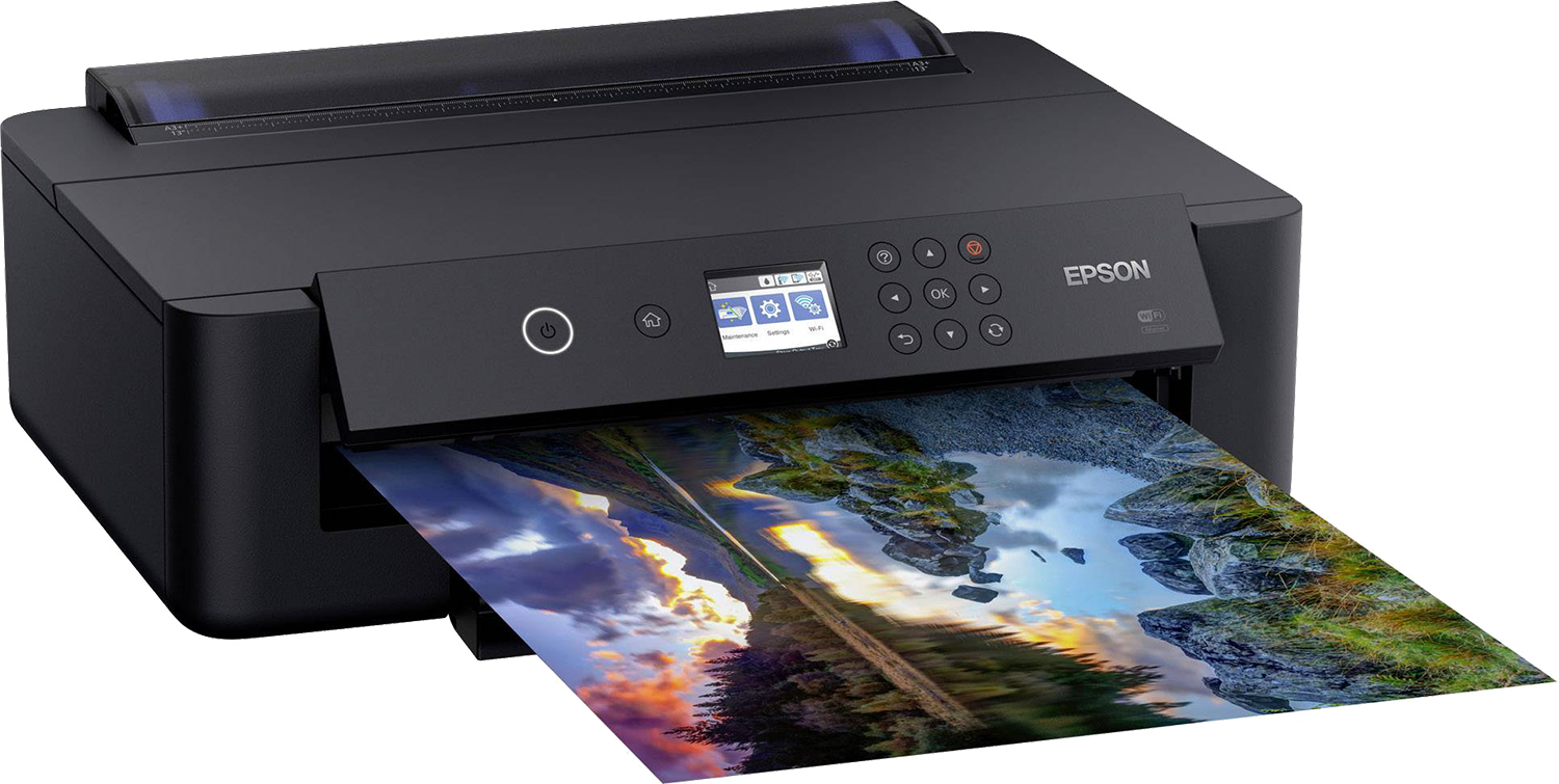 Black printer with a screen printing a color image of a landscape.