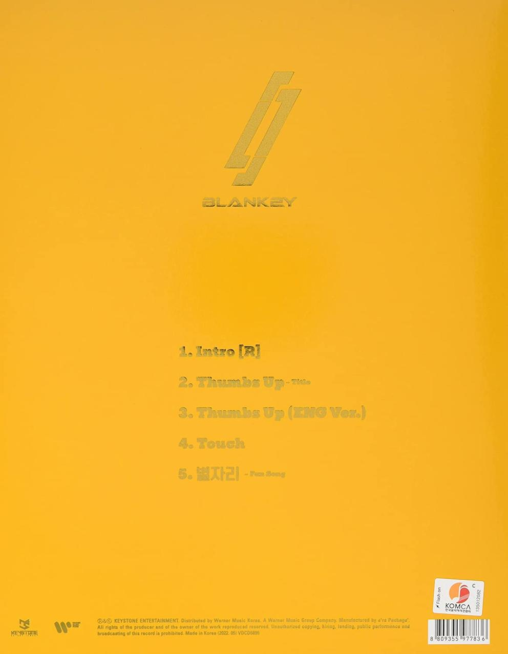 Ein gelbes Albumcover mit Trackliste, mit goldenem Logo und Text, mit Barcode unten.