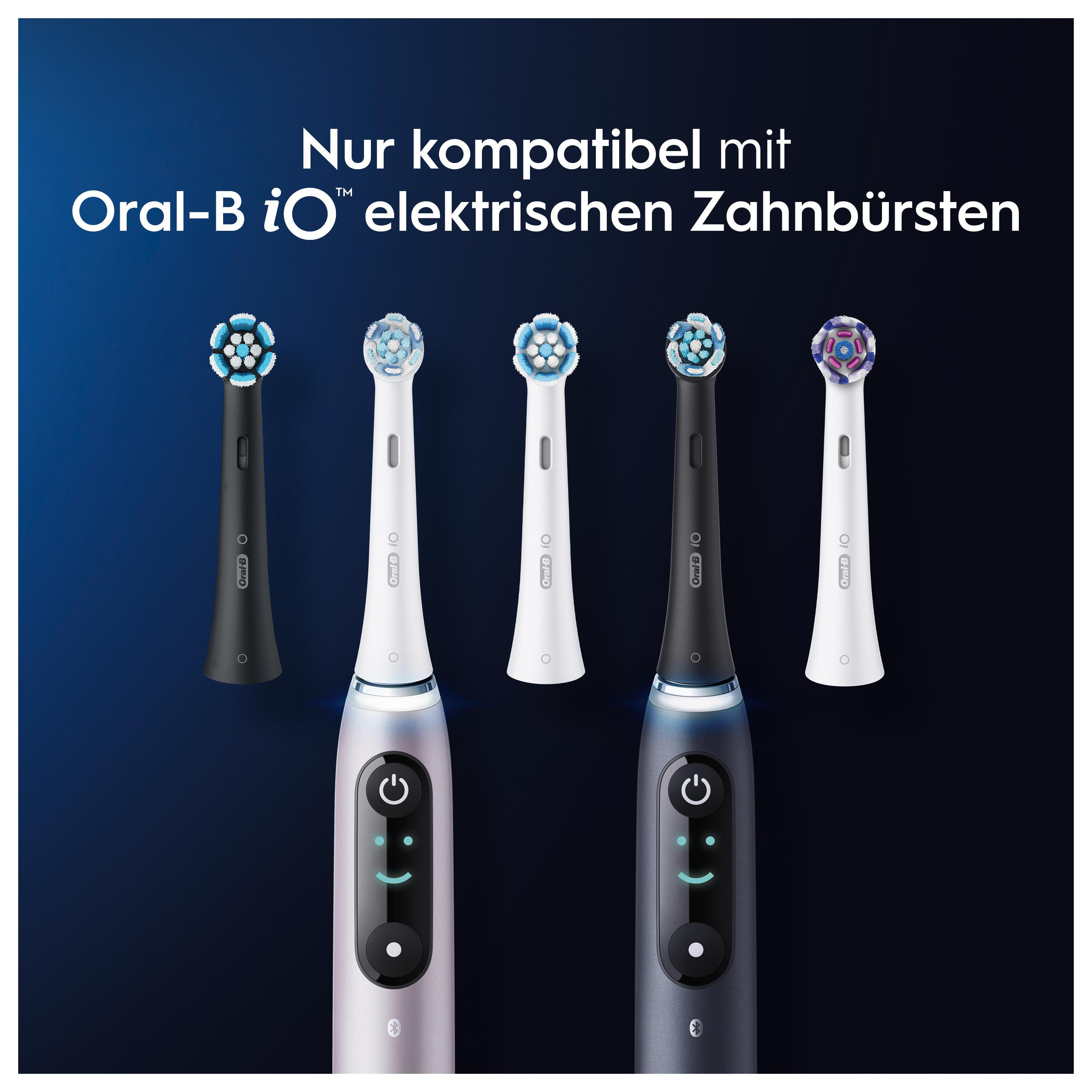 Elektrische Zahnbürsten und Bürstenköpfe von Oral-B iO. Verschiedene Farben und Designs, dunkler Hintergrund.