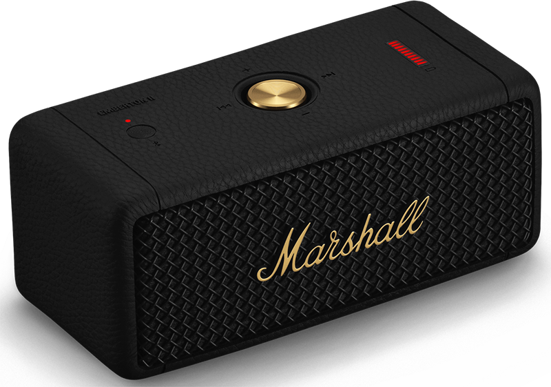 Black Marshall speaker with gold accents. The speaker is on a black surface.
