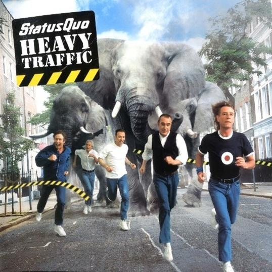 Pochette d'album avec des hommes courant, des éléphants et une scène de rue.
