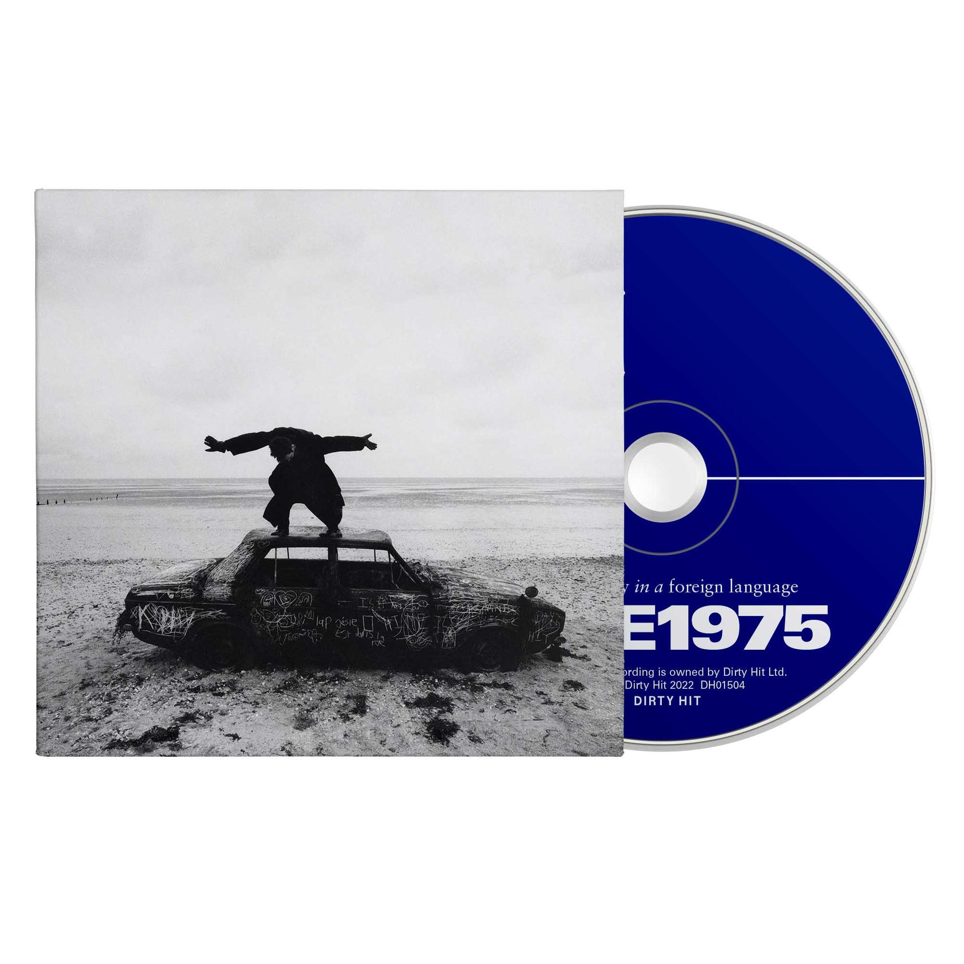 Albumhoes met een auto en een man erop, met een blauwe cd.