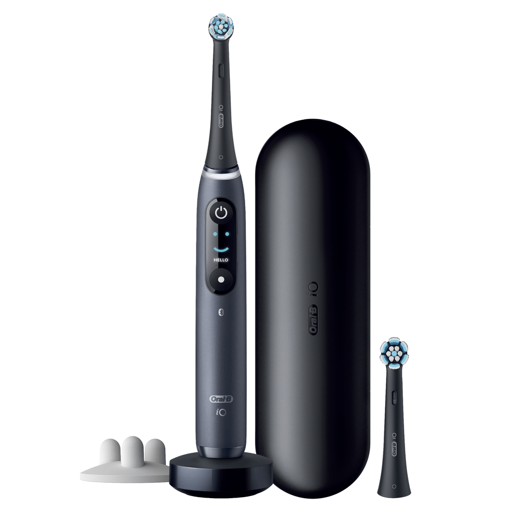 Cepillo de dientes eléctrico negro con base de carga y cabezal extra.