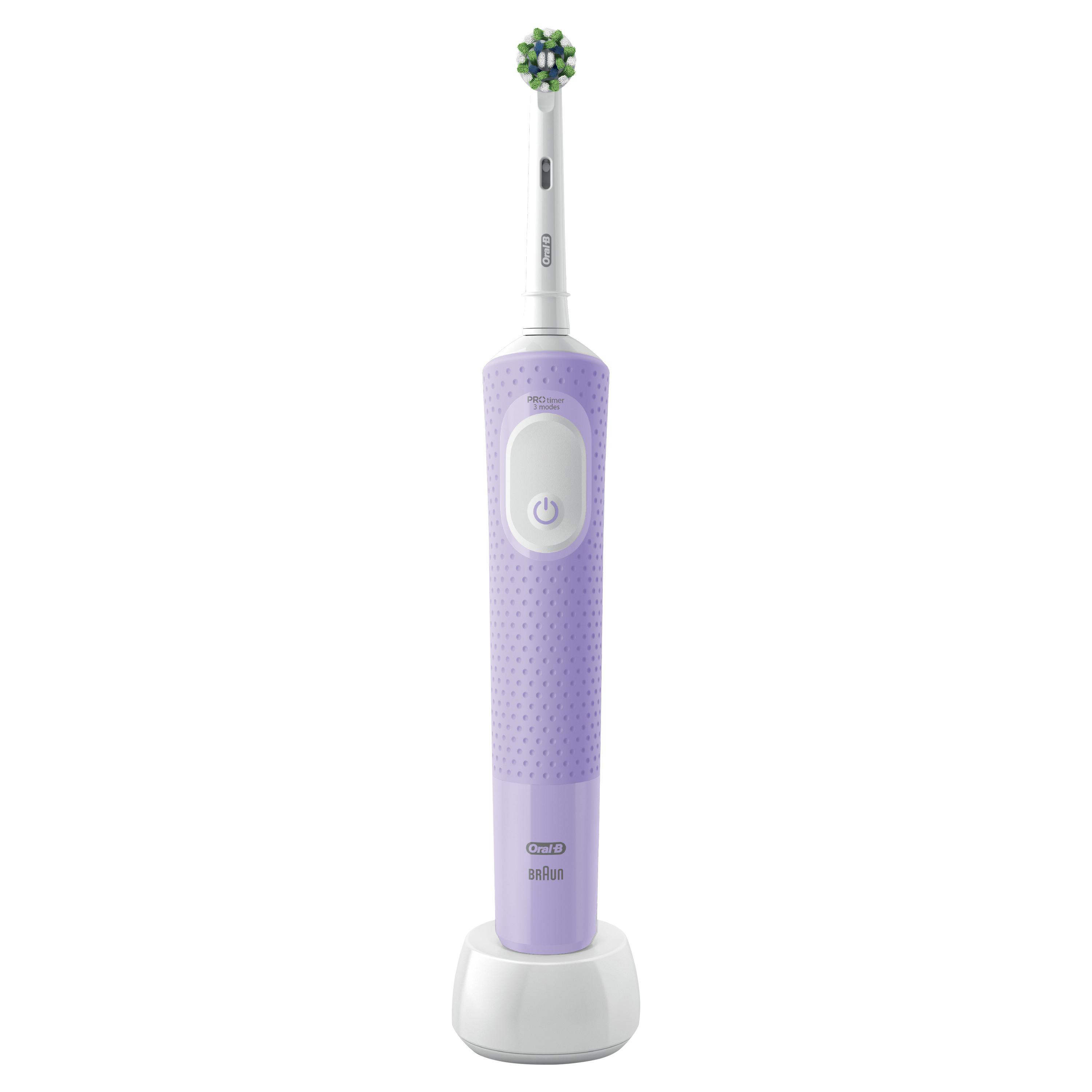 Eine lila elektrische Zahnbürste von Oral-B auf ihrer Ladestation, mit weißer Basis und grünem Bürstenkopf.