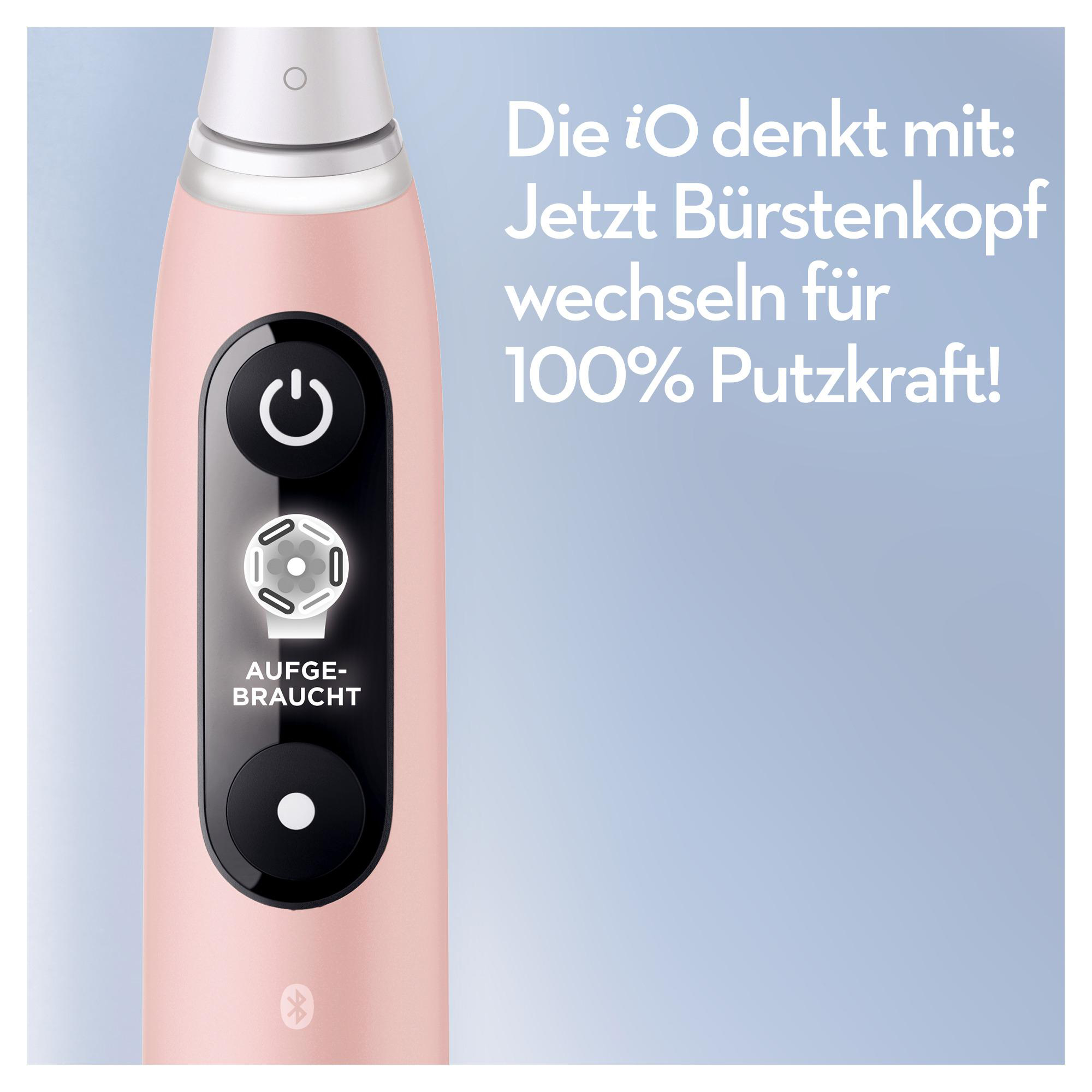 Rosa elektrische Zahnbürste mit Ein-/Aus-Taste.  Weißes Licht zeigt Bürstenkopfwechsel.