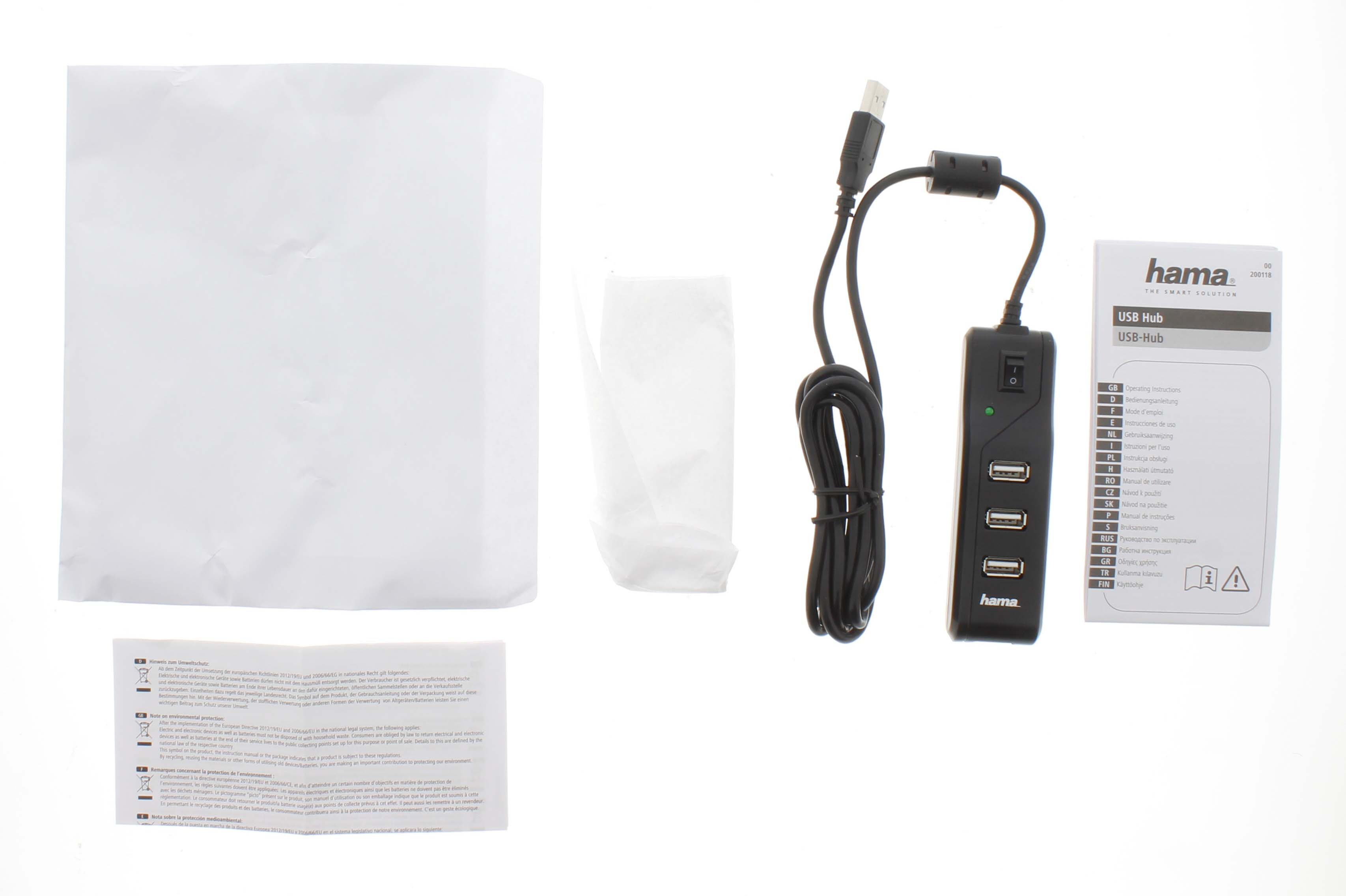Un concentrador USB con cables y un manual, todo sobre un fondo blanco.