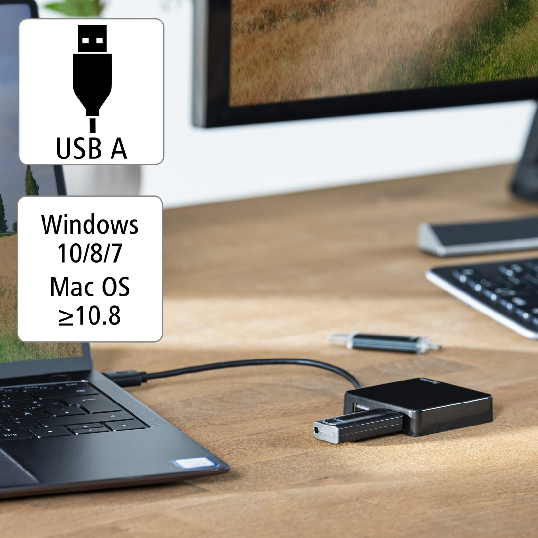 Ordenador portátil conectado a un concentrador USB negro con puerto USB-A.