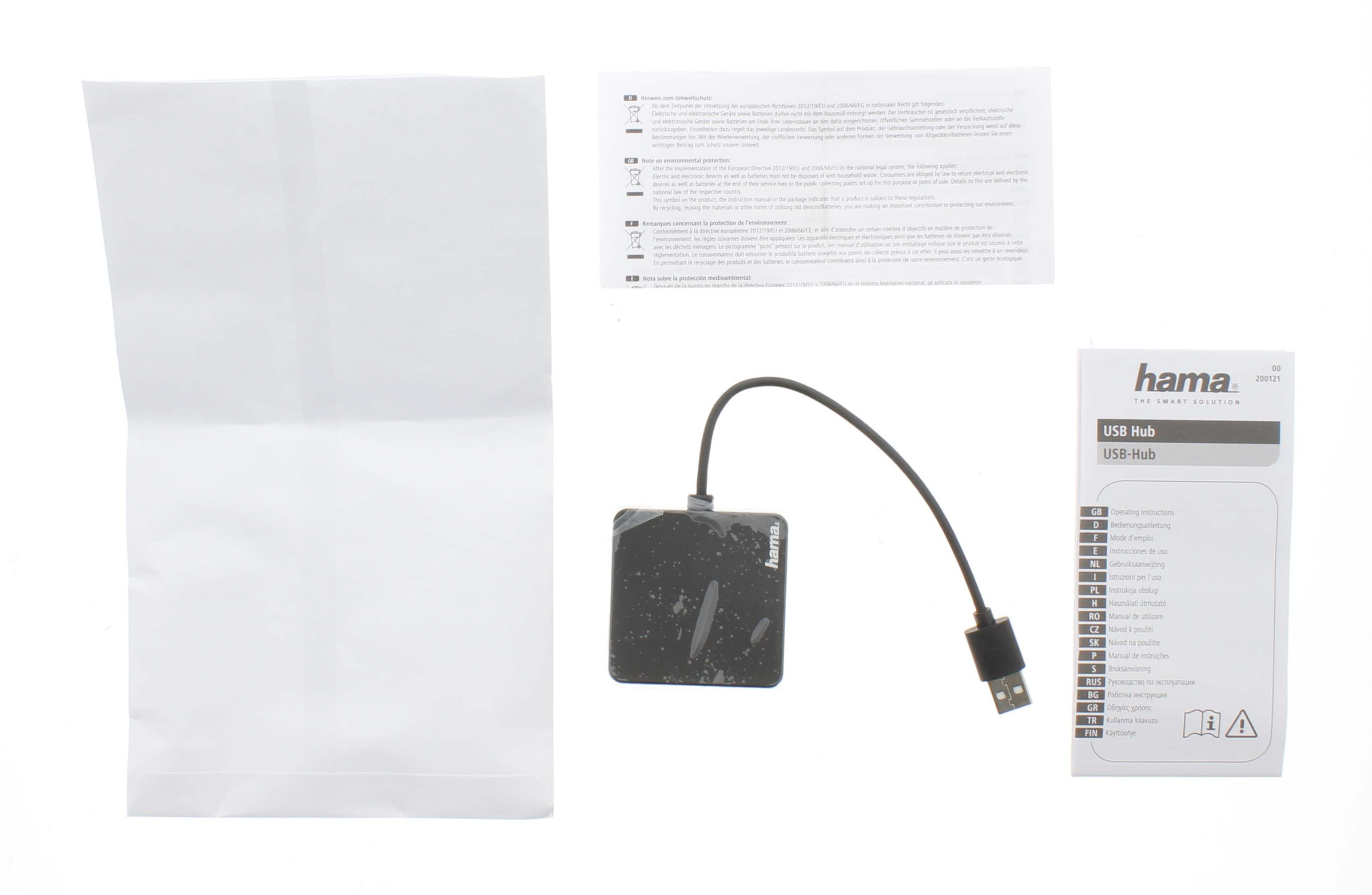 Concentrador USB con cable, embalaje e instrucciones sobre superficie blanca.