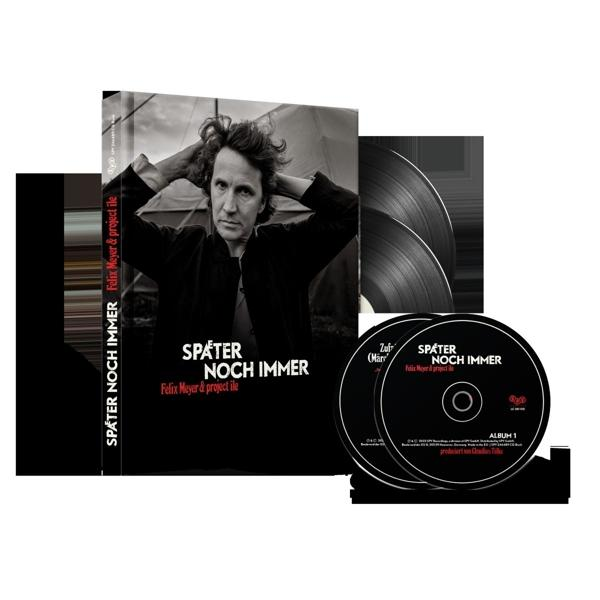 Albumcover mit Mann, der seinen Kopf hält. CDs und Schallplatten sichtbar. Text: Später noch immer.