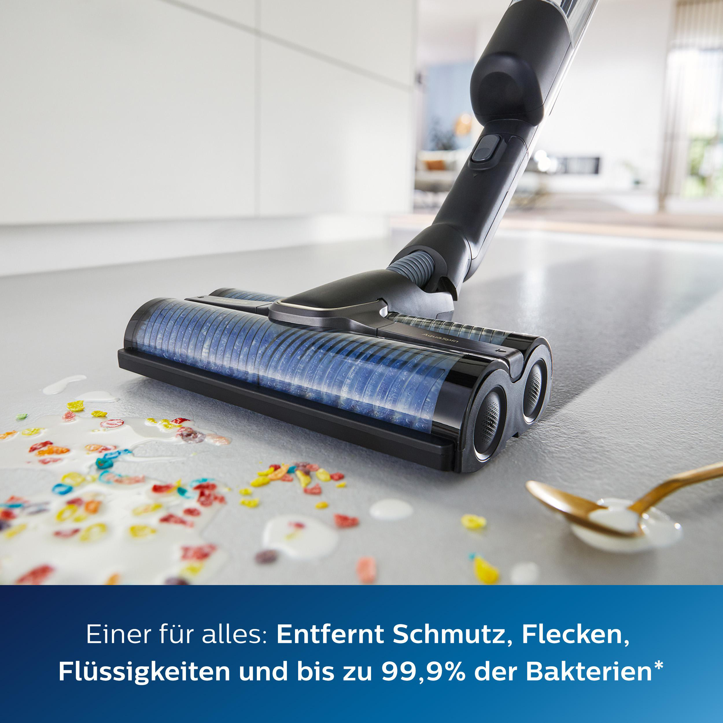 Ein Staubsaugerkopf auf einem Boden mit verschüttetem Müsli und Milch.