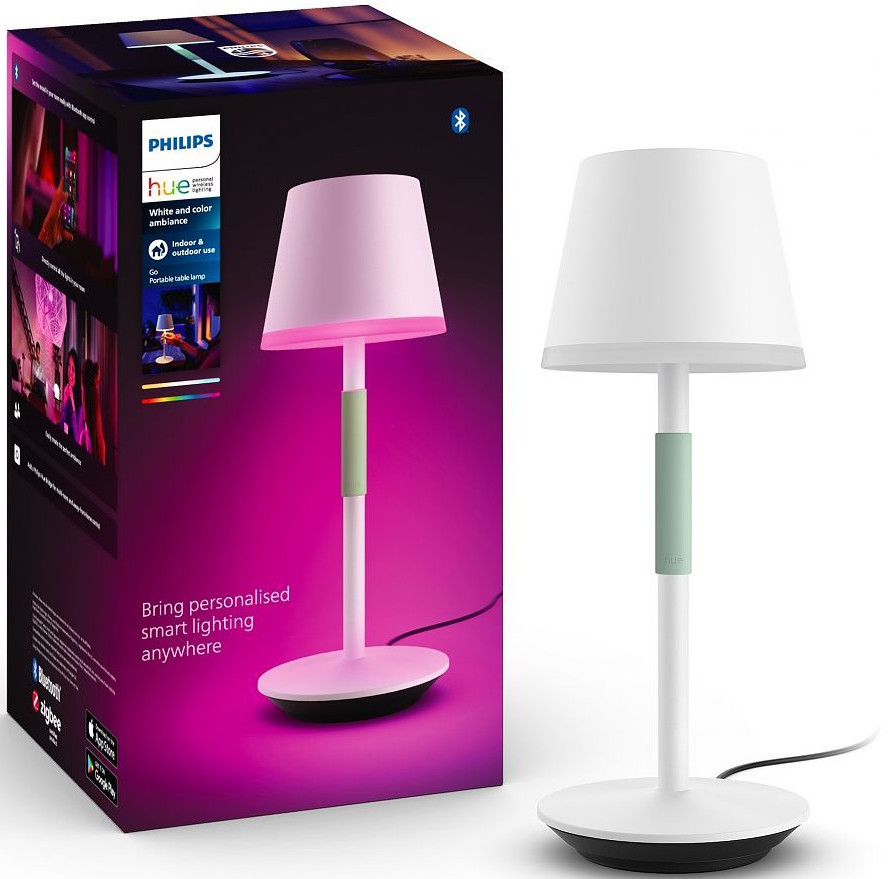 Witte slimme lamp met roze lampenkap, groene steel en doos met info en lamp.