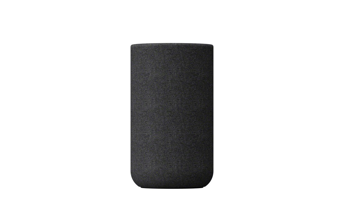 Altavoz de tela gris oscuro, forma cilíndrica, aislado sobre fondo blanco.
