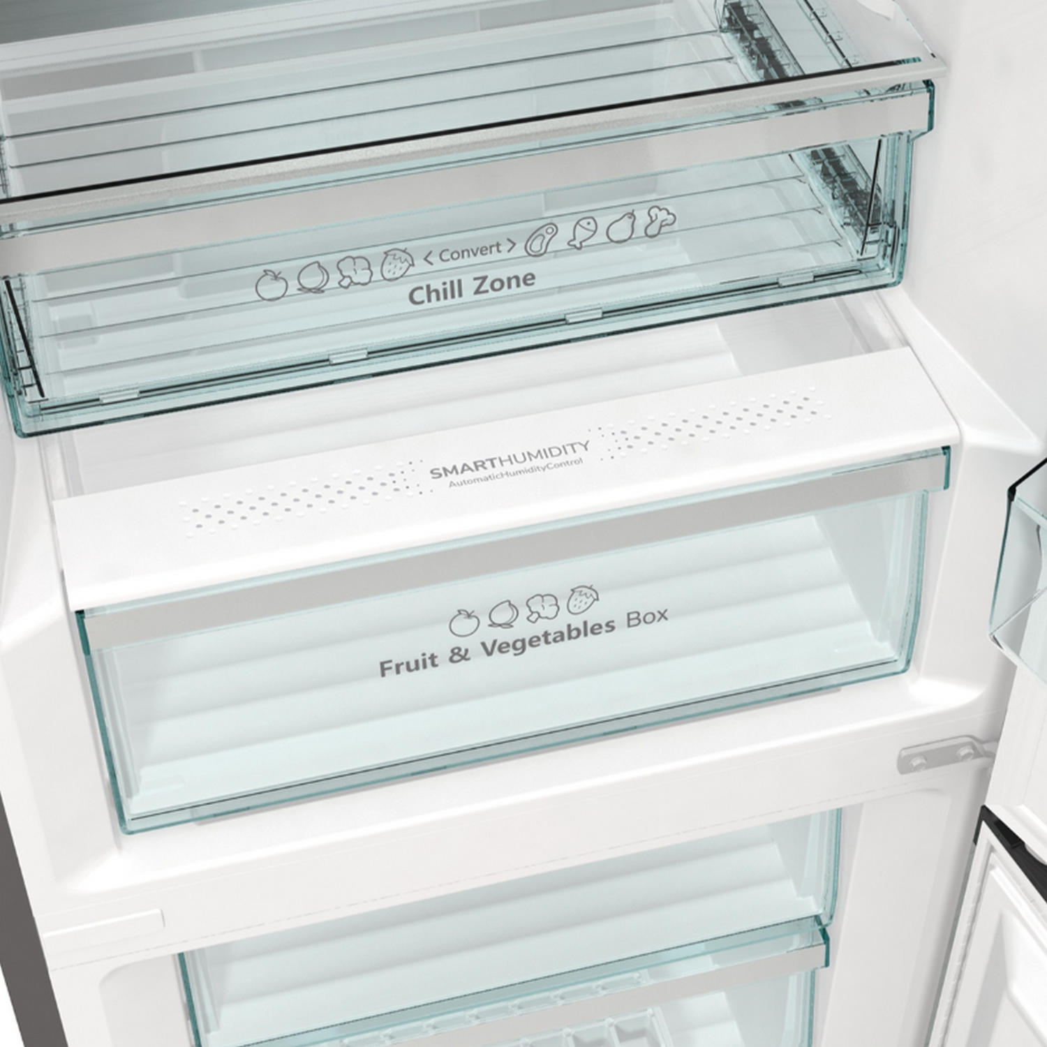 Primer plano de un refrigerador con cajones etiquetados como 'Chill Zone' y 'Fruit & Vegetables Box'.