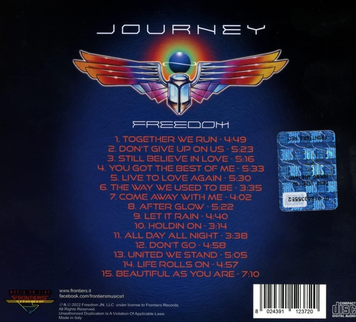 Le dos de l'album Journey - Freedom. La couverture est bleu foncé, avec la liste des pistes.