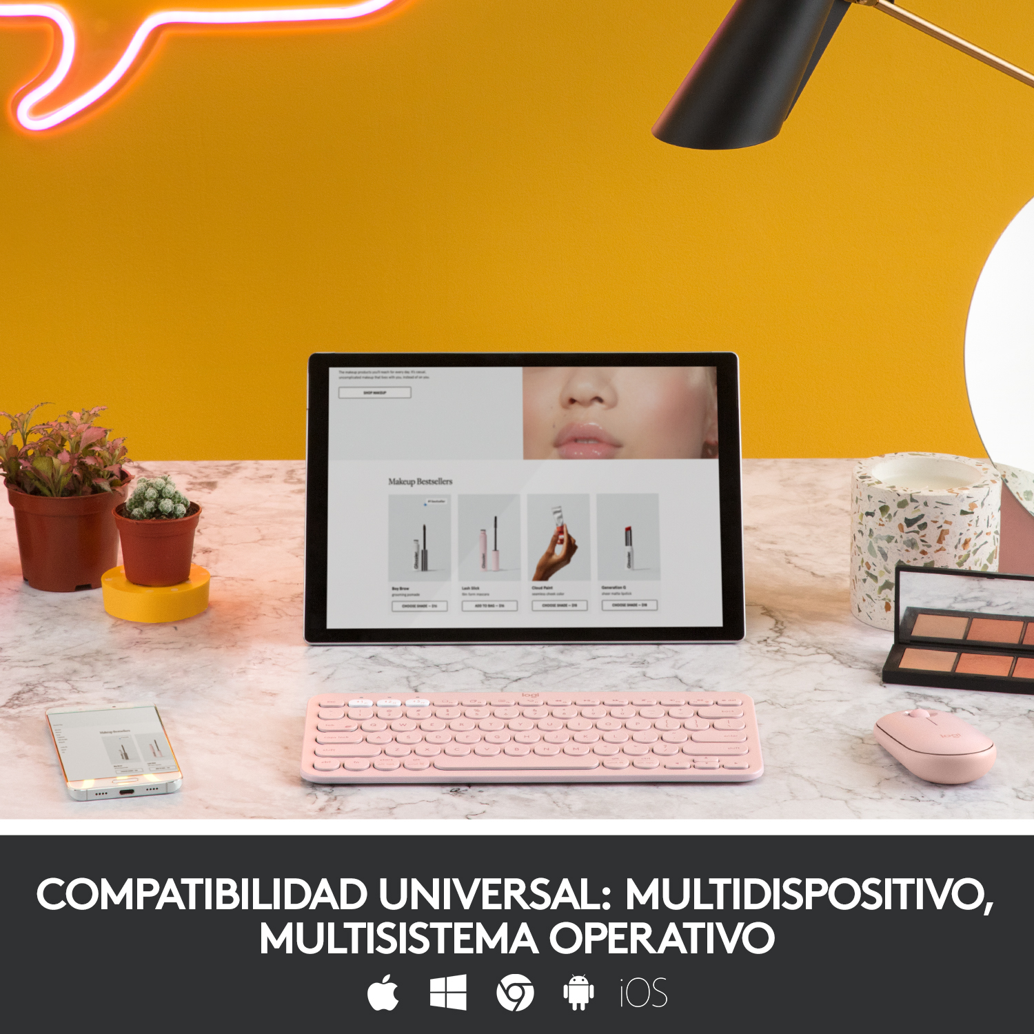 Un teclado inalámbrico rosa con una tableta y un ratón en un escritorio.