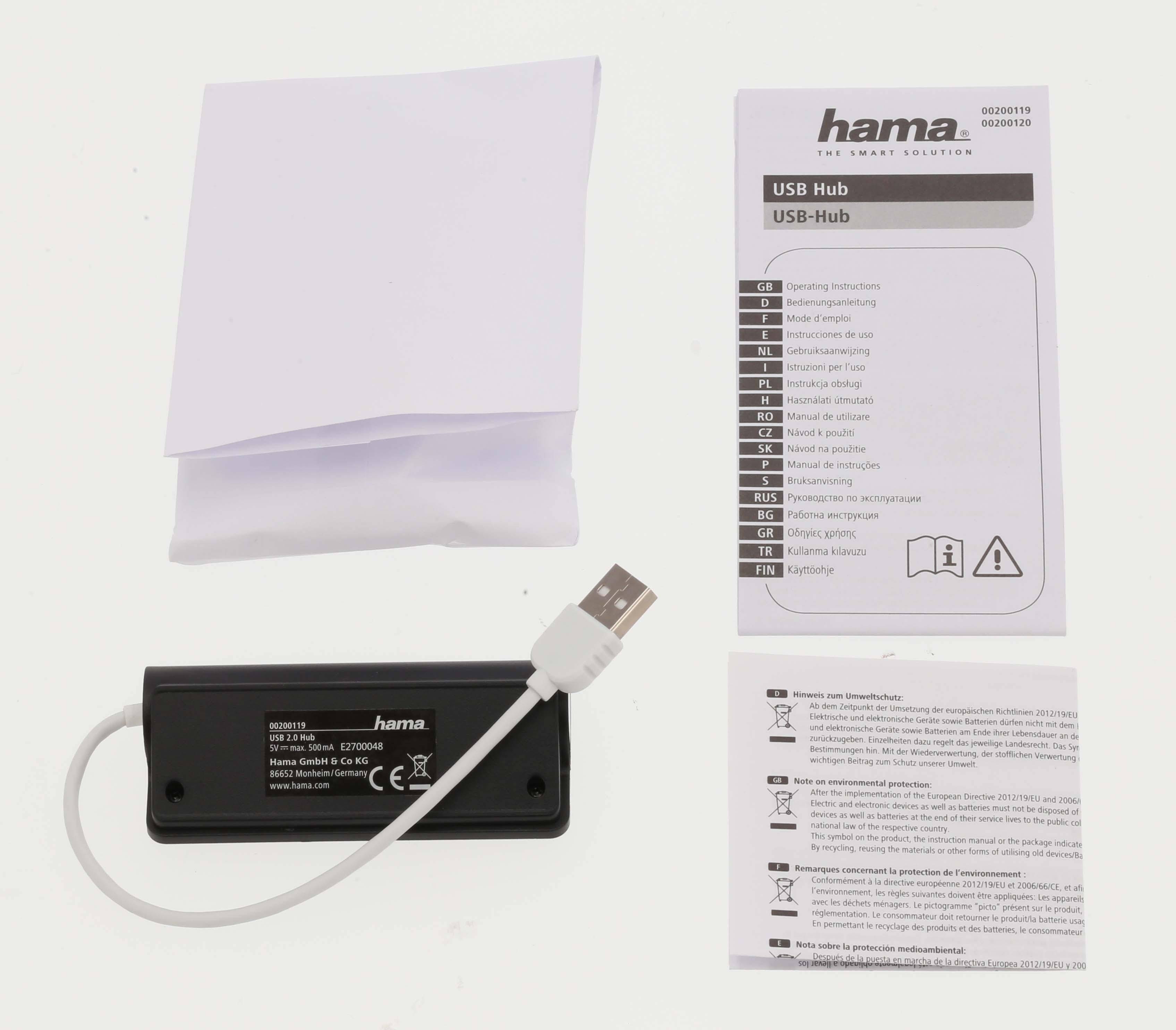 Hama USB Hub, con cable USB y múltiples manuales sobre una superficie blanca.