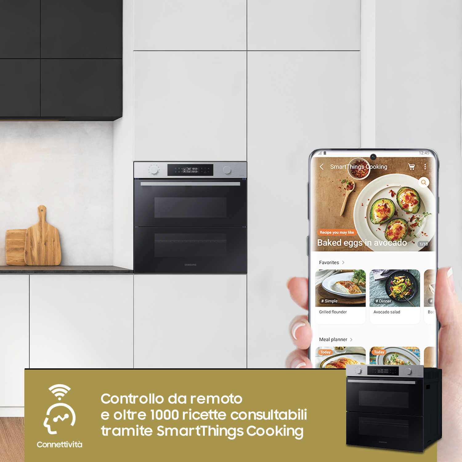 Una moderna cucina con un forno e un telefono che mostra un'app di cucina.