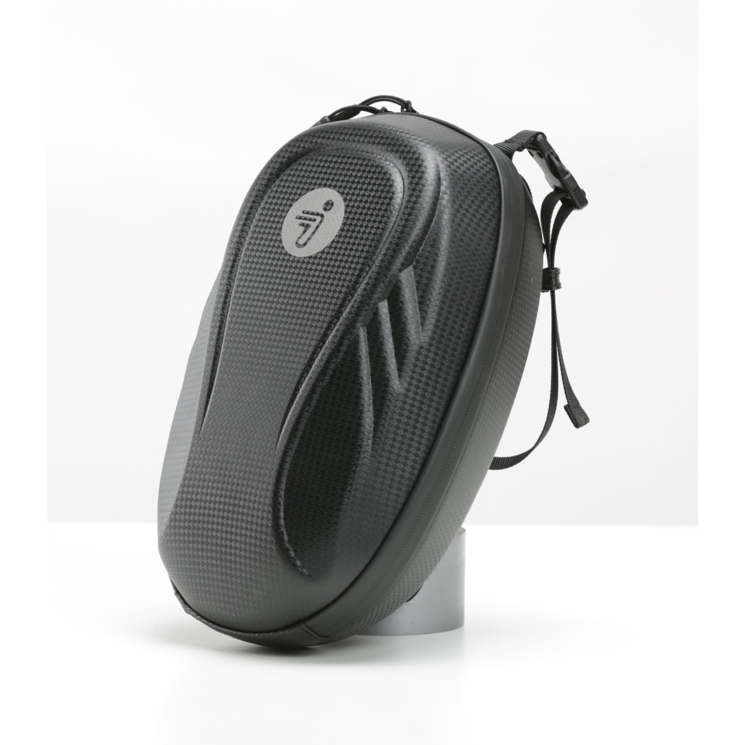 Black and gray motorcycle bag with a carbon fiber texture, on a white backdrop.