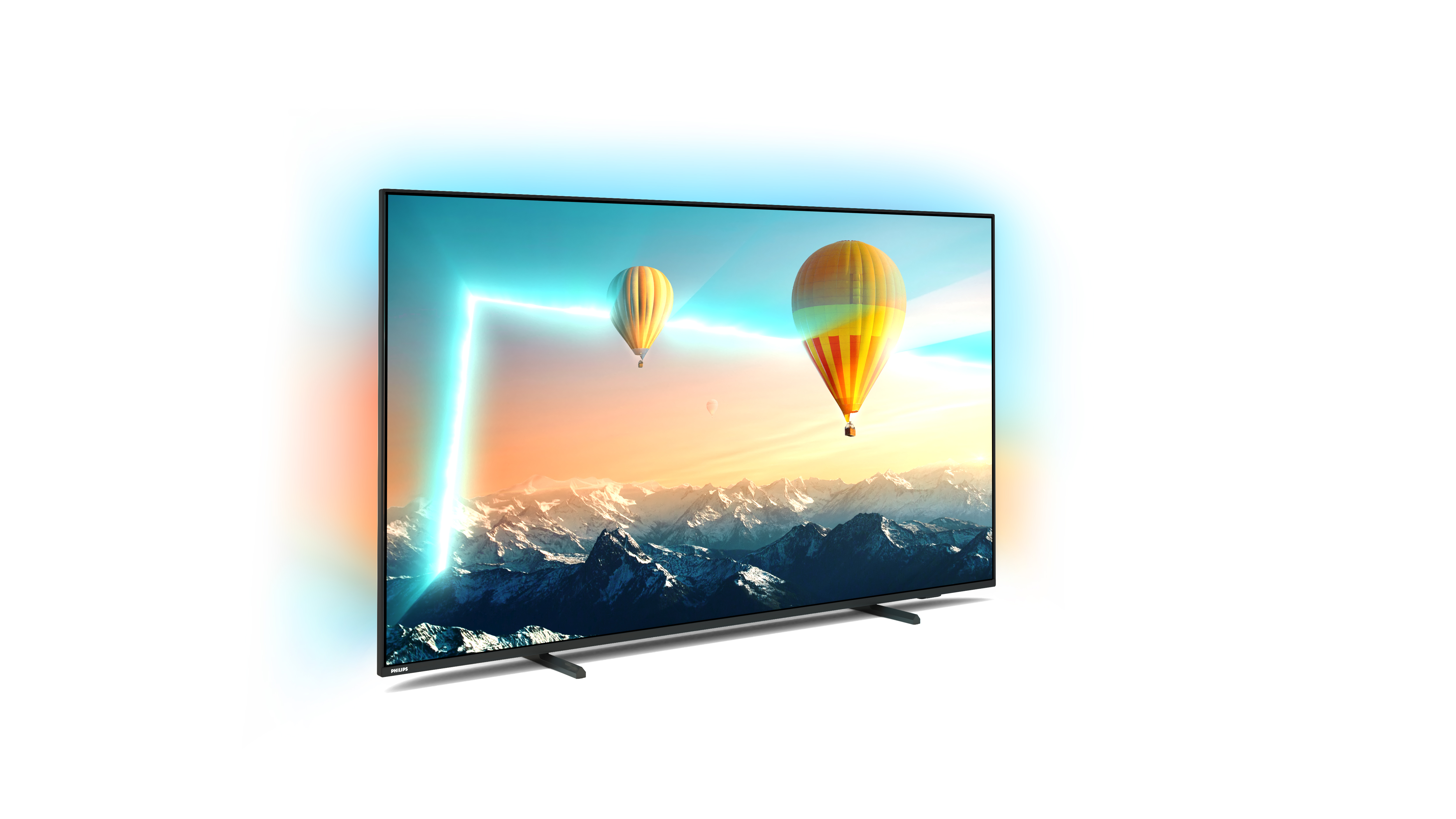 Dağların üzerinde sıcak hava balonları ve parlayan bir çerçeve ile bir TV ekranı.