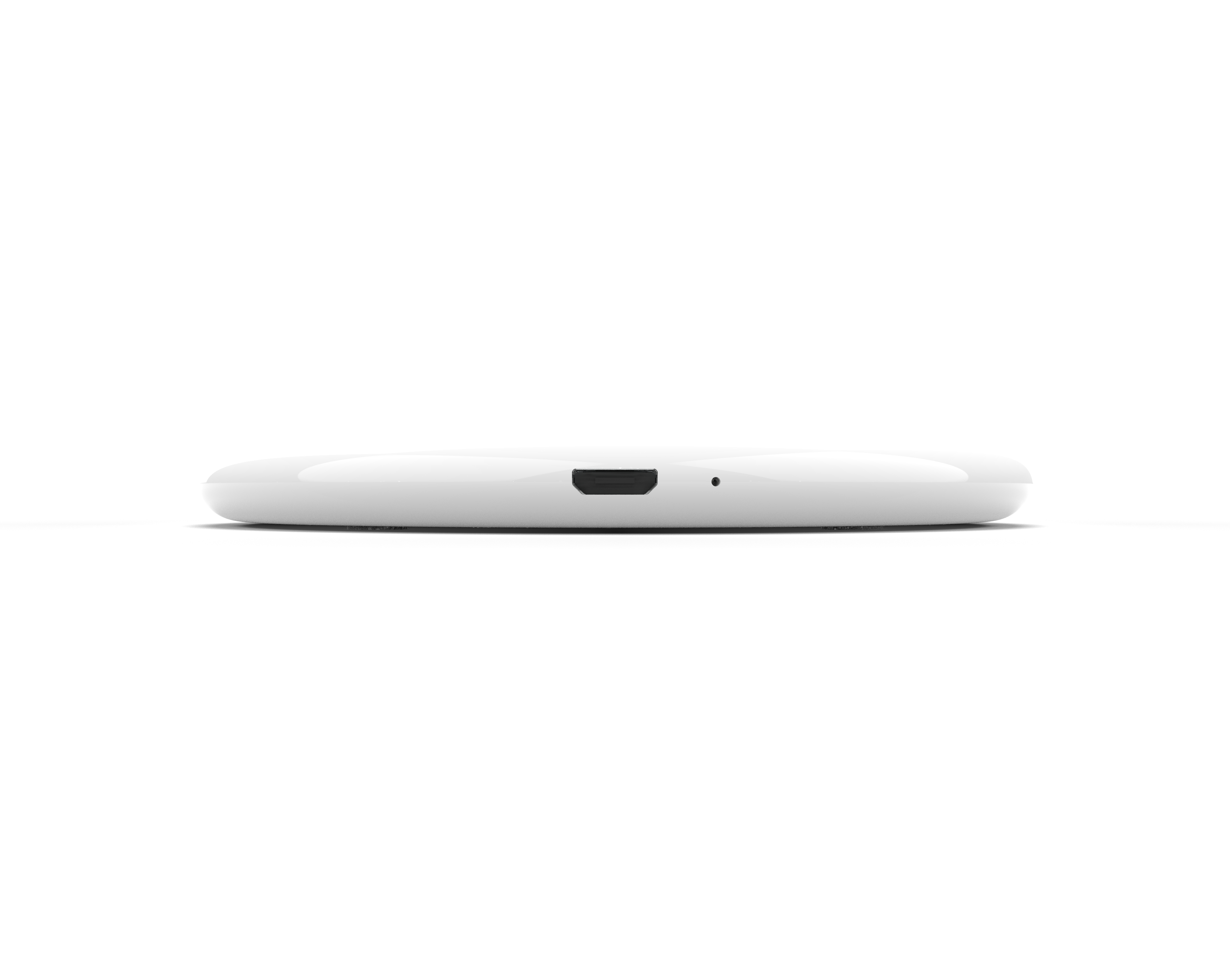 Ein weißes, kreisförmiges kabelloses Ladegerät mit einem USB-Anschluss an der Seite.