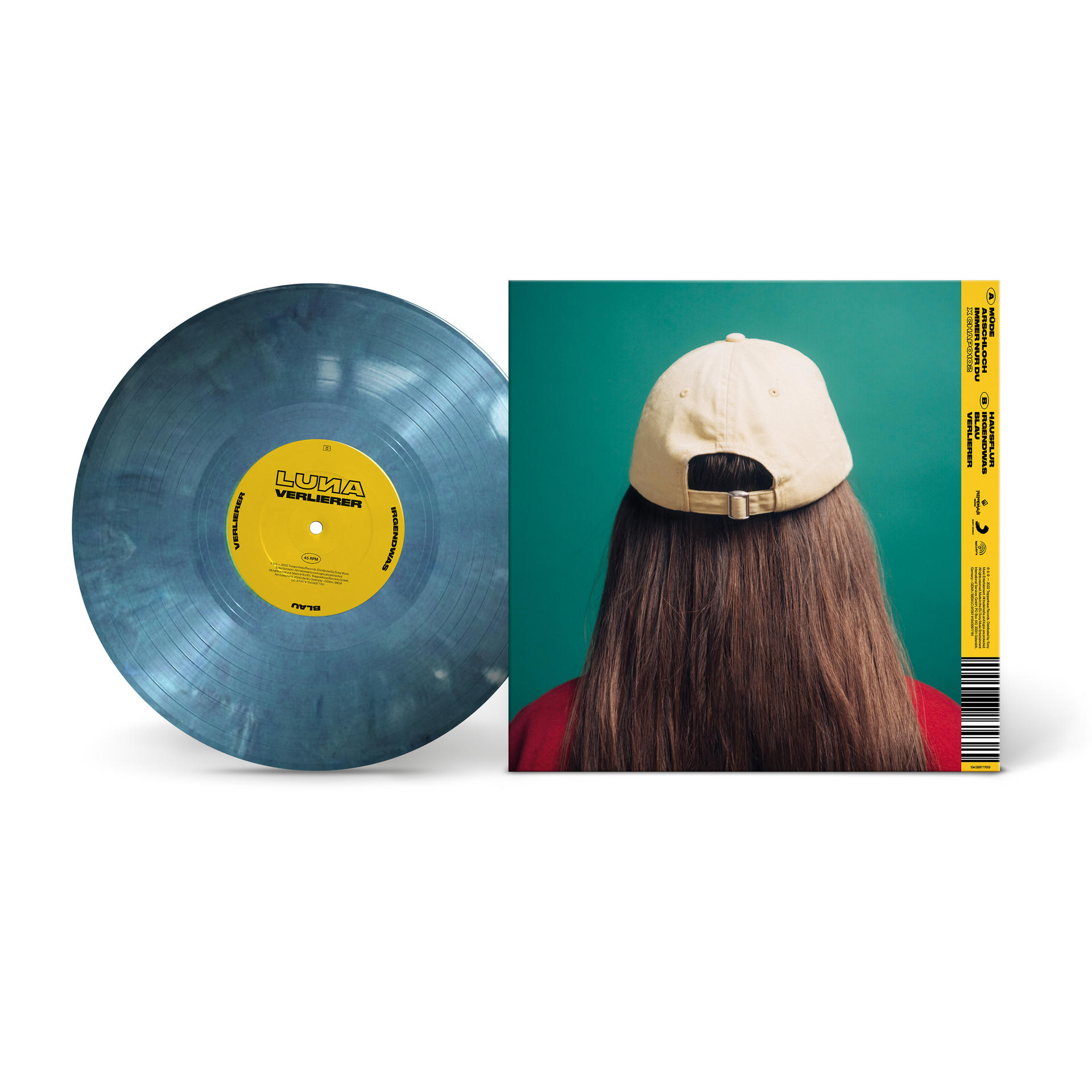Eine Schallplatte und ein Albumcover mit einem Foto einer Person mit Mütze.