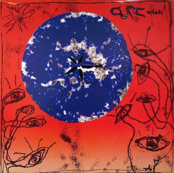 Albumcover mit blauem Kreis, rotem Hintergrund und abstrakten Illustrationen, mit 'The Cure' und 'Wish'.