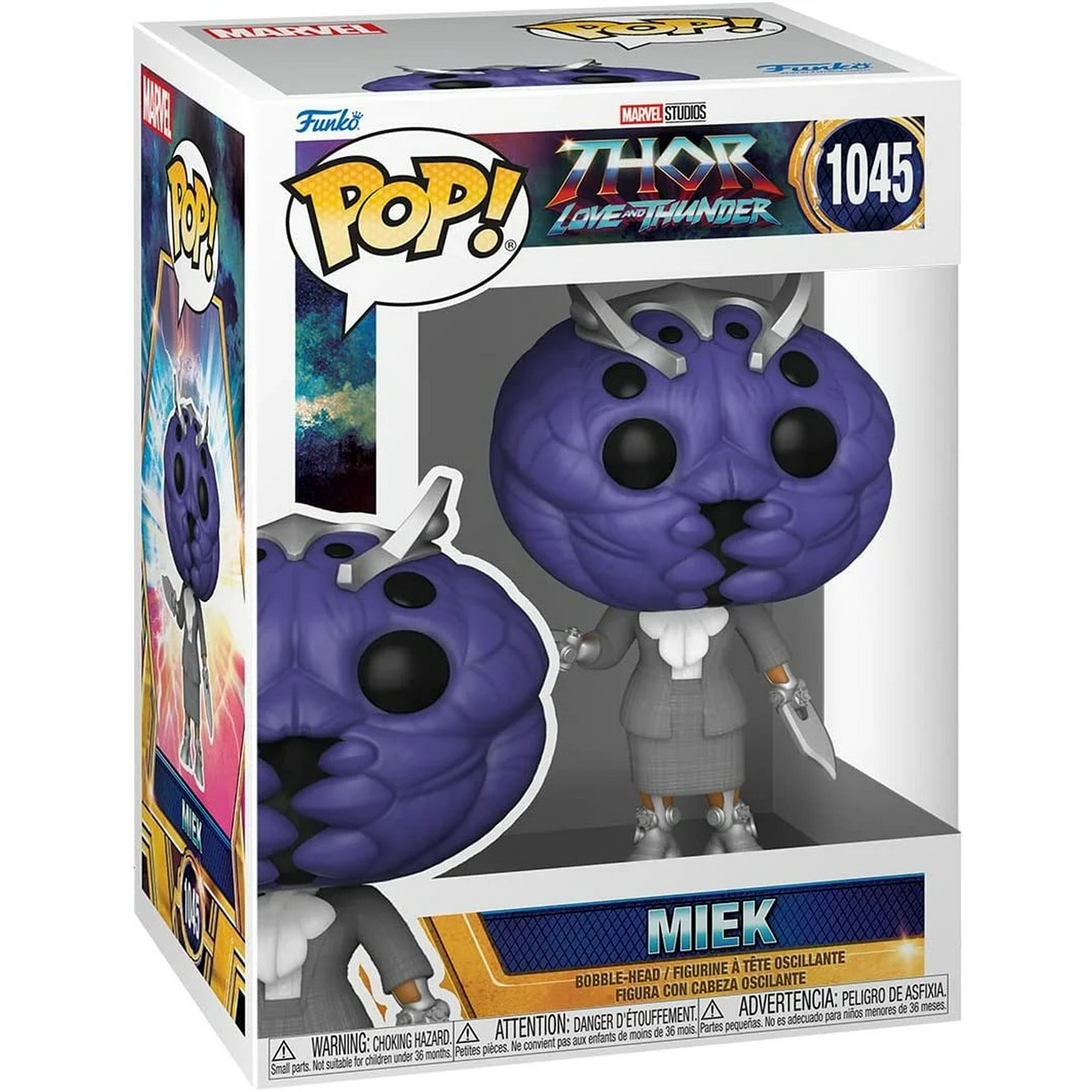 Figura Funko Pop en una caja. Figura de un personaje con traje gris y cabeza morada. Estilo cómic.