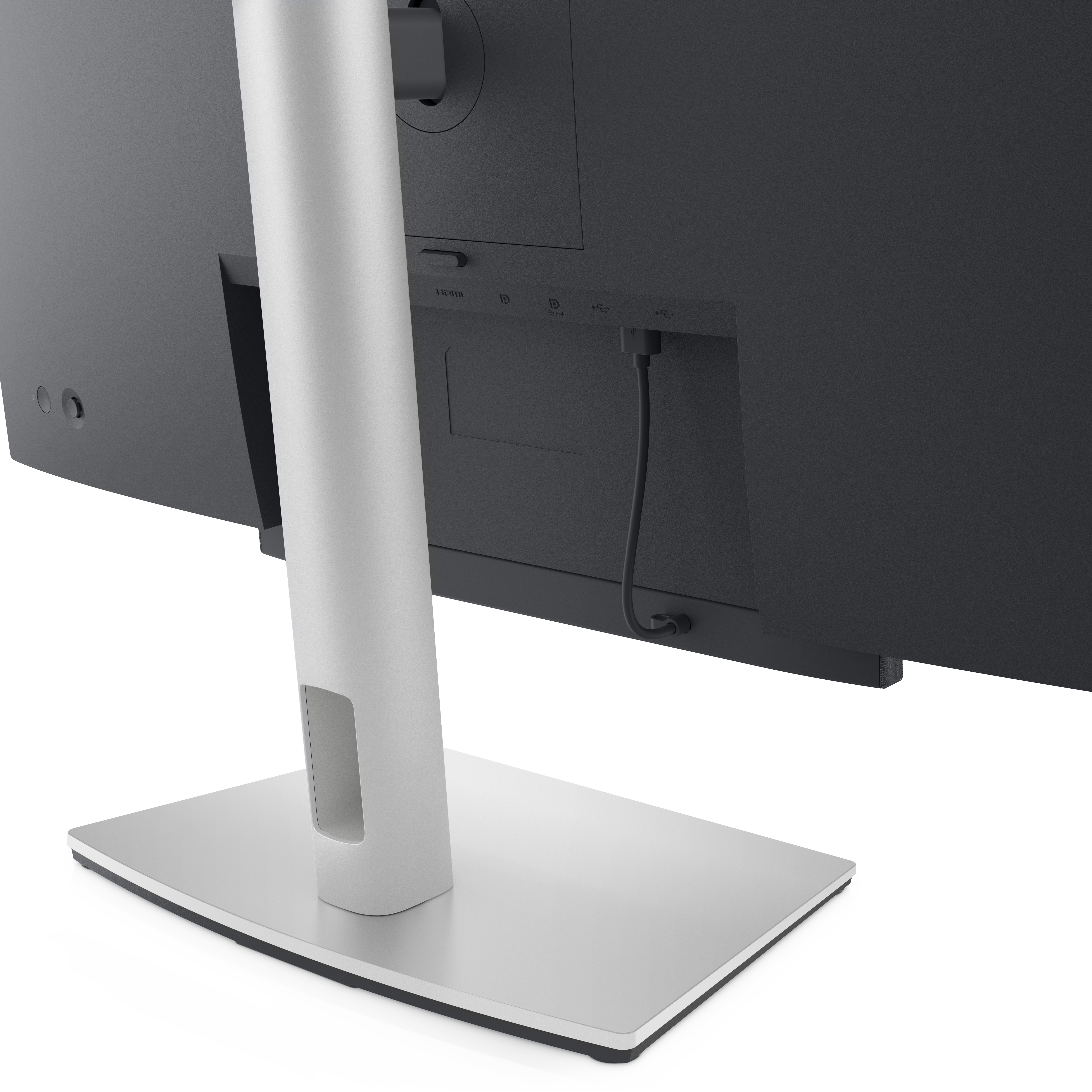 Die Rückseite eines Computermonitors mit Ständer. Der Monitor ist schwarz, der Ständer silbern, ein schwarzes Kabel ist eingesteckt.
