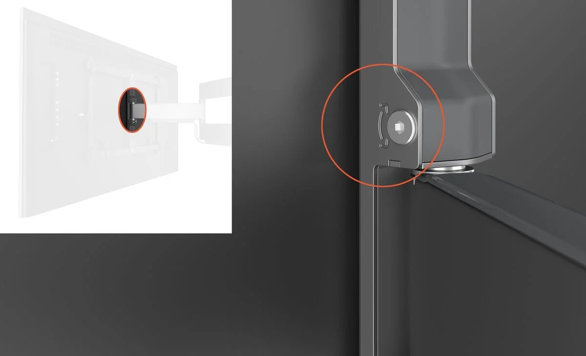 Close-up van een monitorbevestiging met een kleine schroef gemarkeerd.