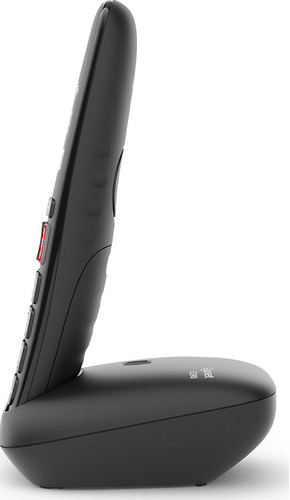Téléphone sans fil noir sur fond blanc. Vue latérale, montrant les boutons et la base.