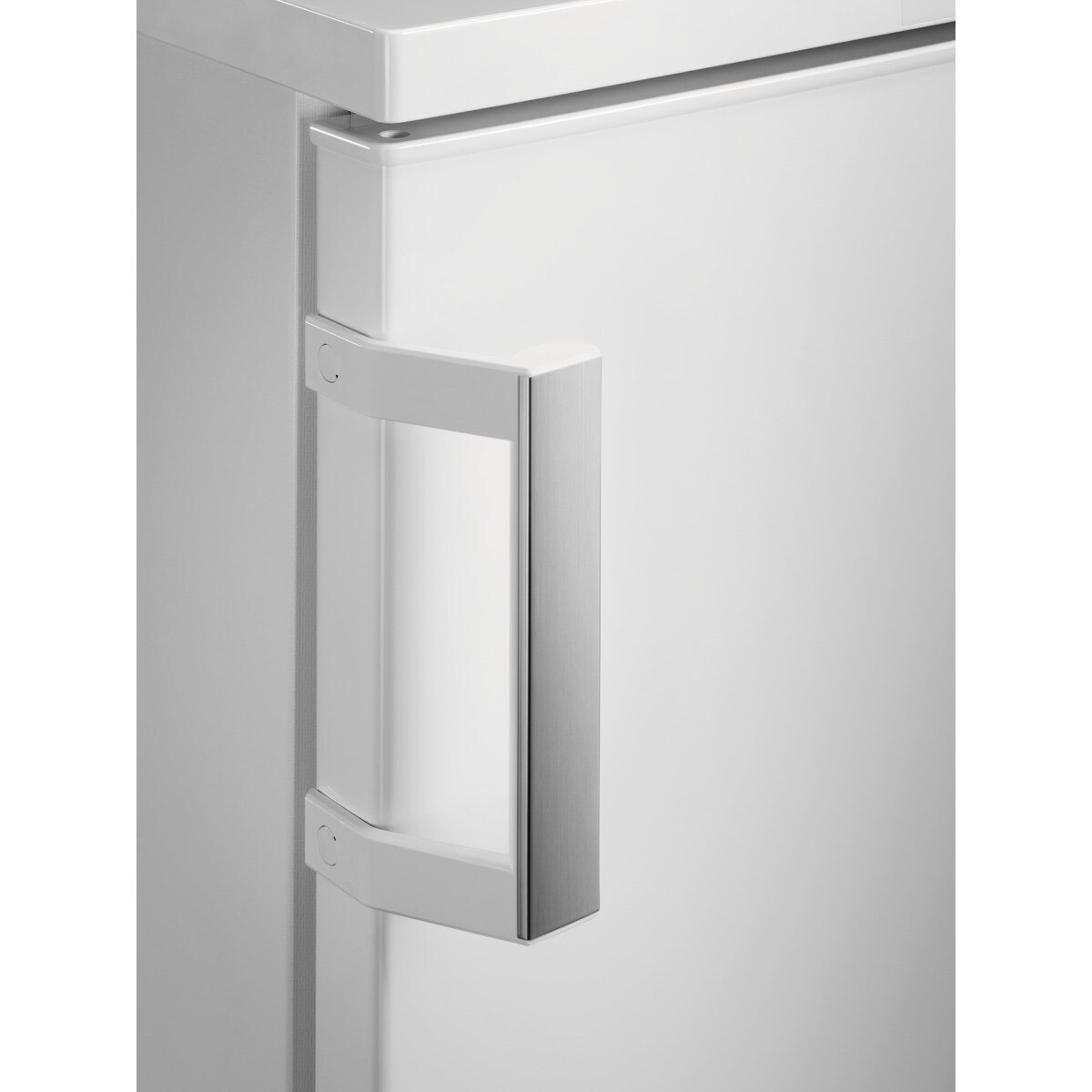 Close-up of a white refrigerator door with a silver handle.