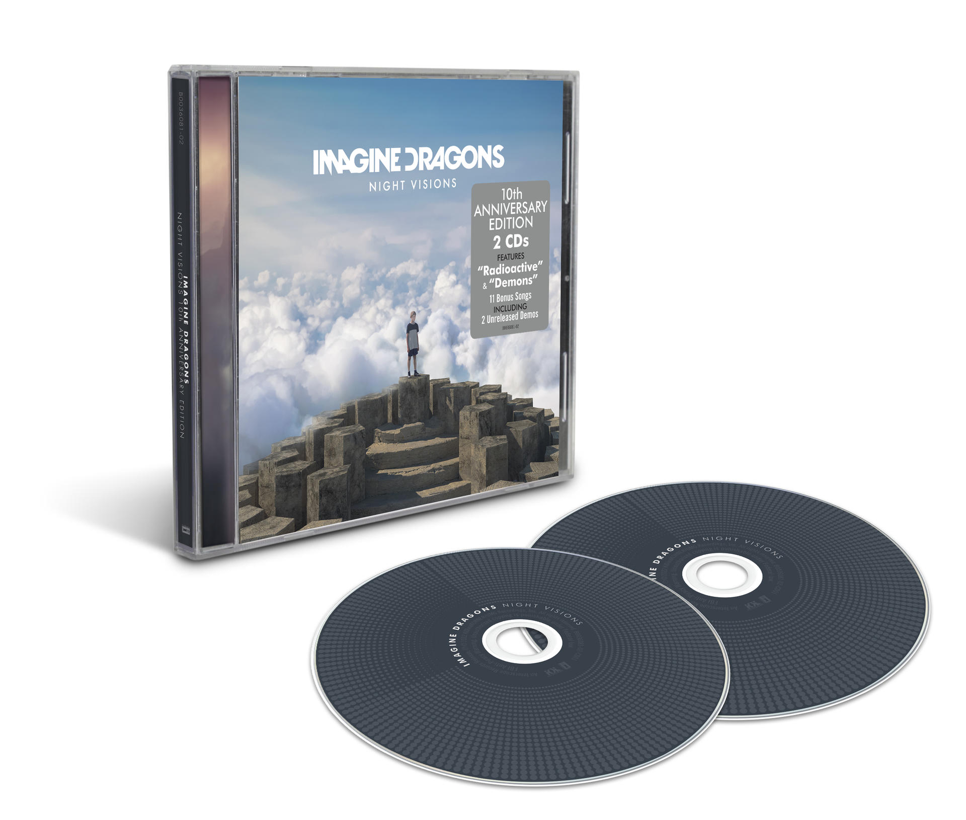 Album Imagine Dragons, deux CD et un boîtier sur une surface blanche.