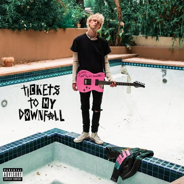 Férfi rózsaszín gitárral. Album borító: Tickets to My Downfall. Medence és zöld lombozat a háttérben.
