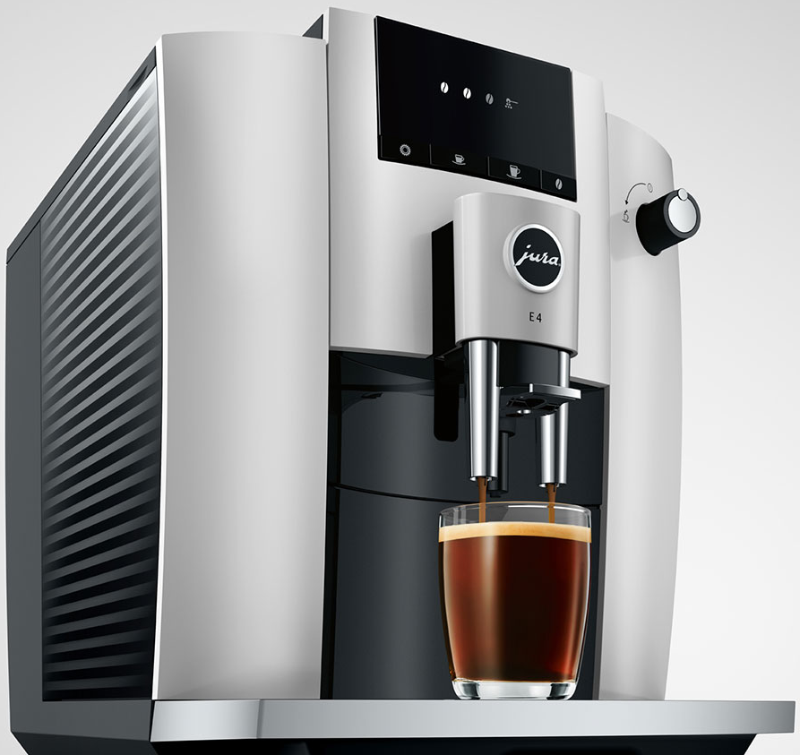 Macchina per caffè espresso con bicchiere che si riempie, design bianco e nero.