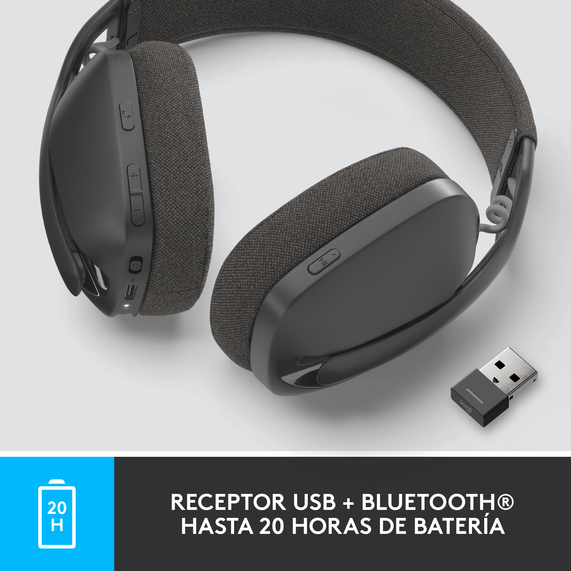 Auriculares grises con un receptor USB en primer plano. Icono de batería azul visible.