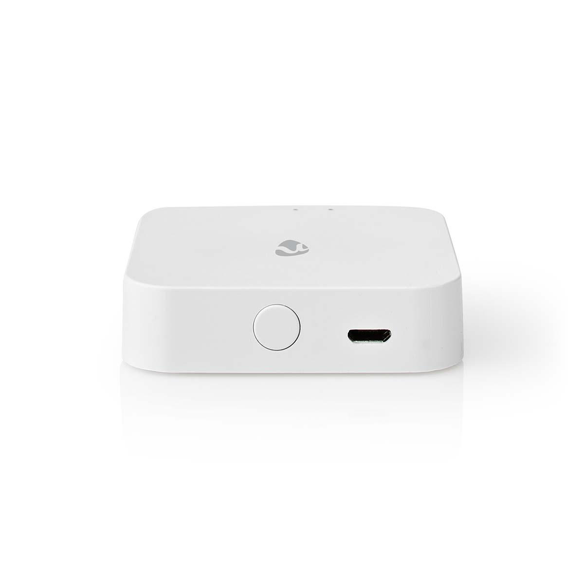 Ein weißes, quadratisches Nedis Smart Home Gerät mit einem kleinen Kreis und einem USB-Anschluss.