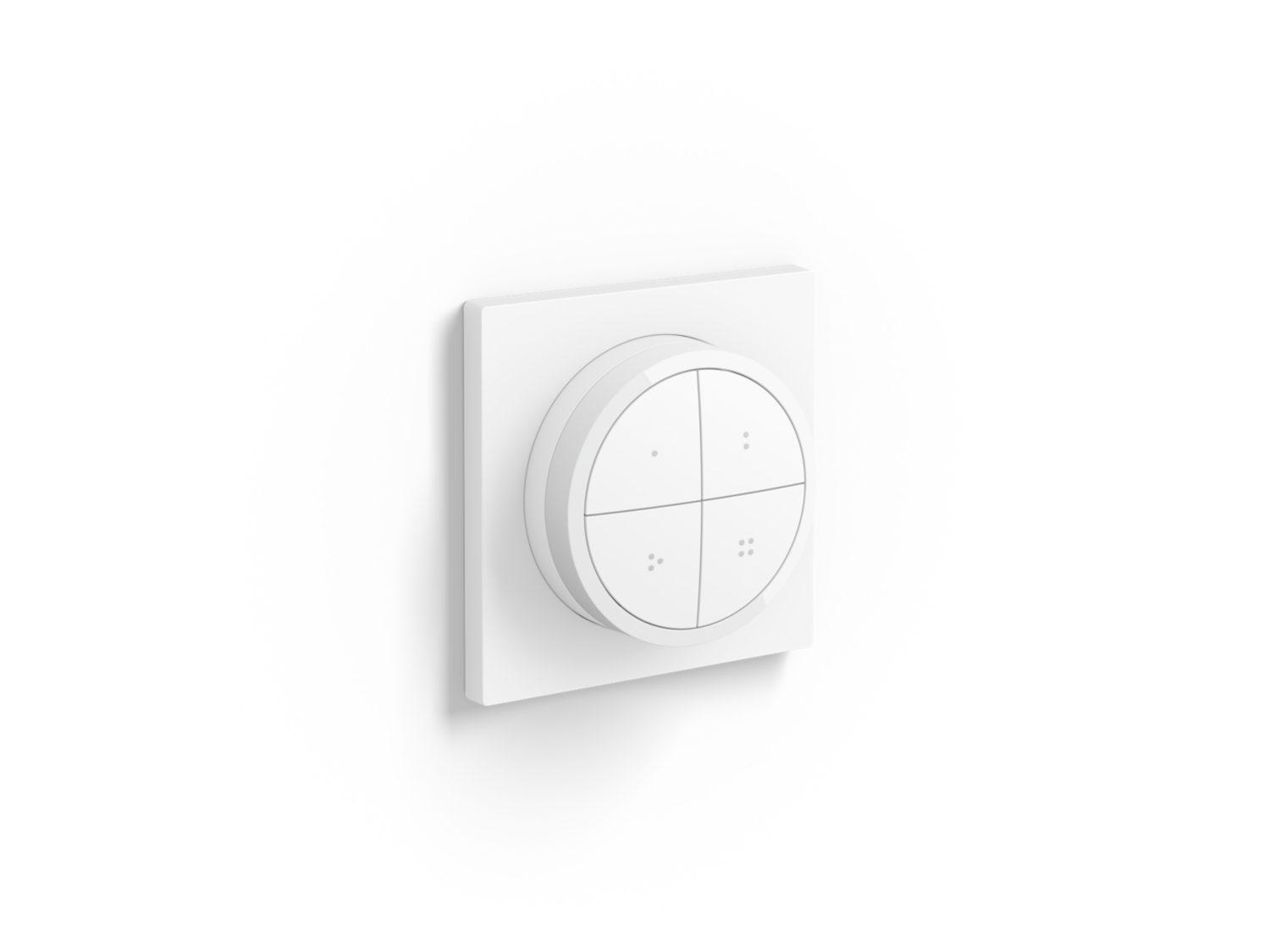 Ein weißes, an der Wand montiertes Smart-Home-Bedienfeld mit vier kreisförmigen Steuertasten.