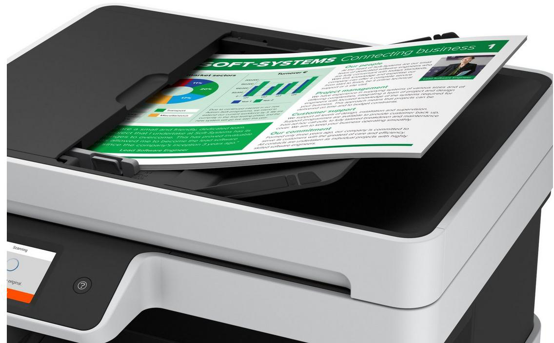 A printer with a document inside, with charts and text, is open.