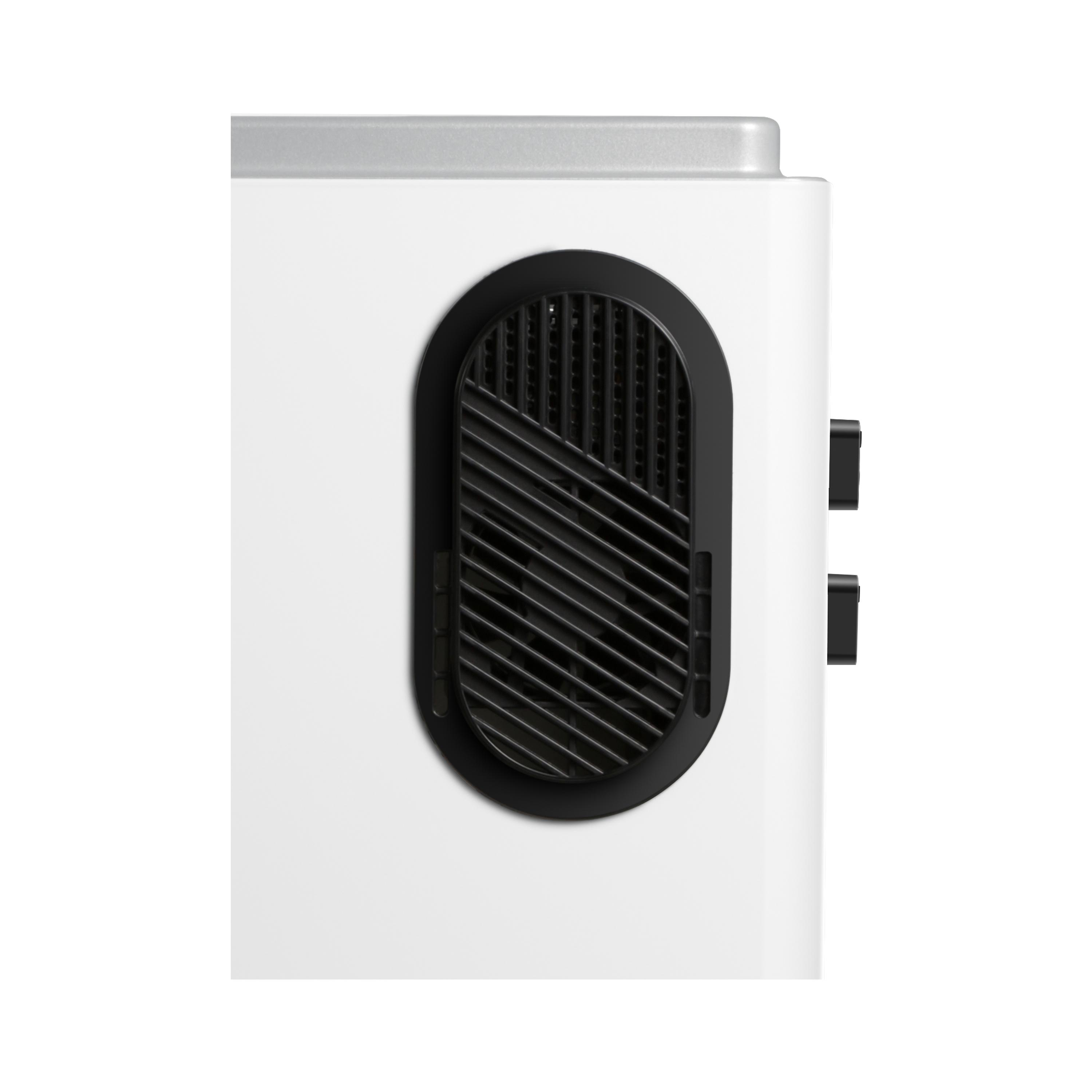 Nahaufnahme eines weißen Geräts mit schwarzem Lüfter. Mit schwarzem, ovalem Lüfter.
