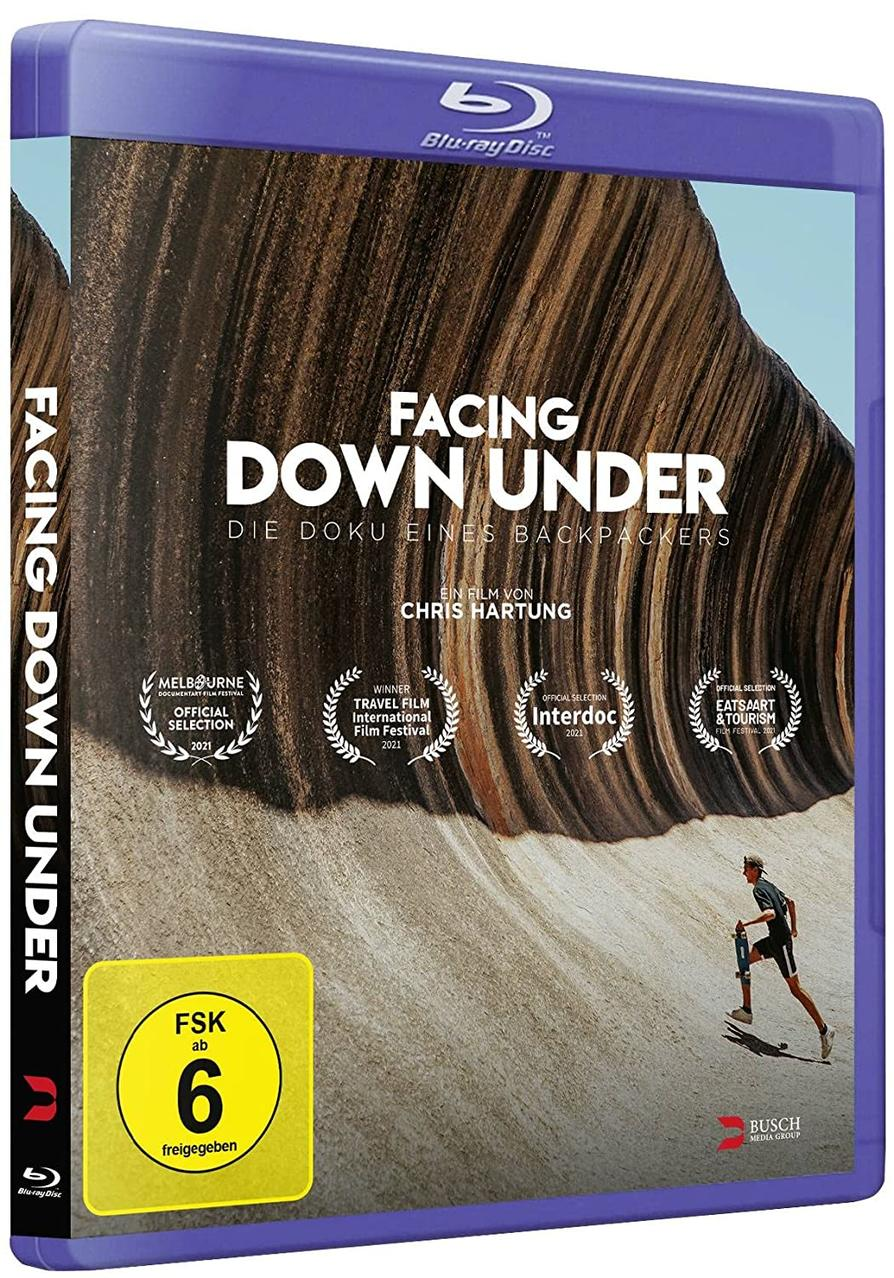 Blu-ray-Disc-Hülle mit dem Titel 'Facing Down Under'. Bild einer wandernden Person.