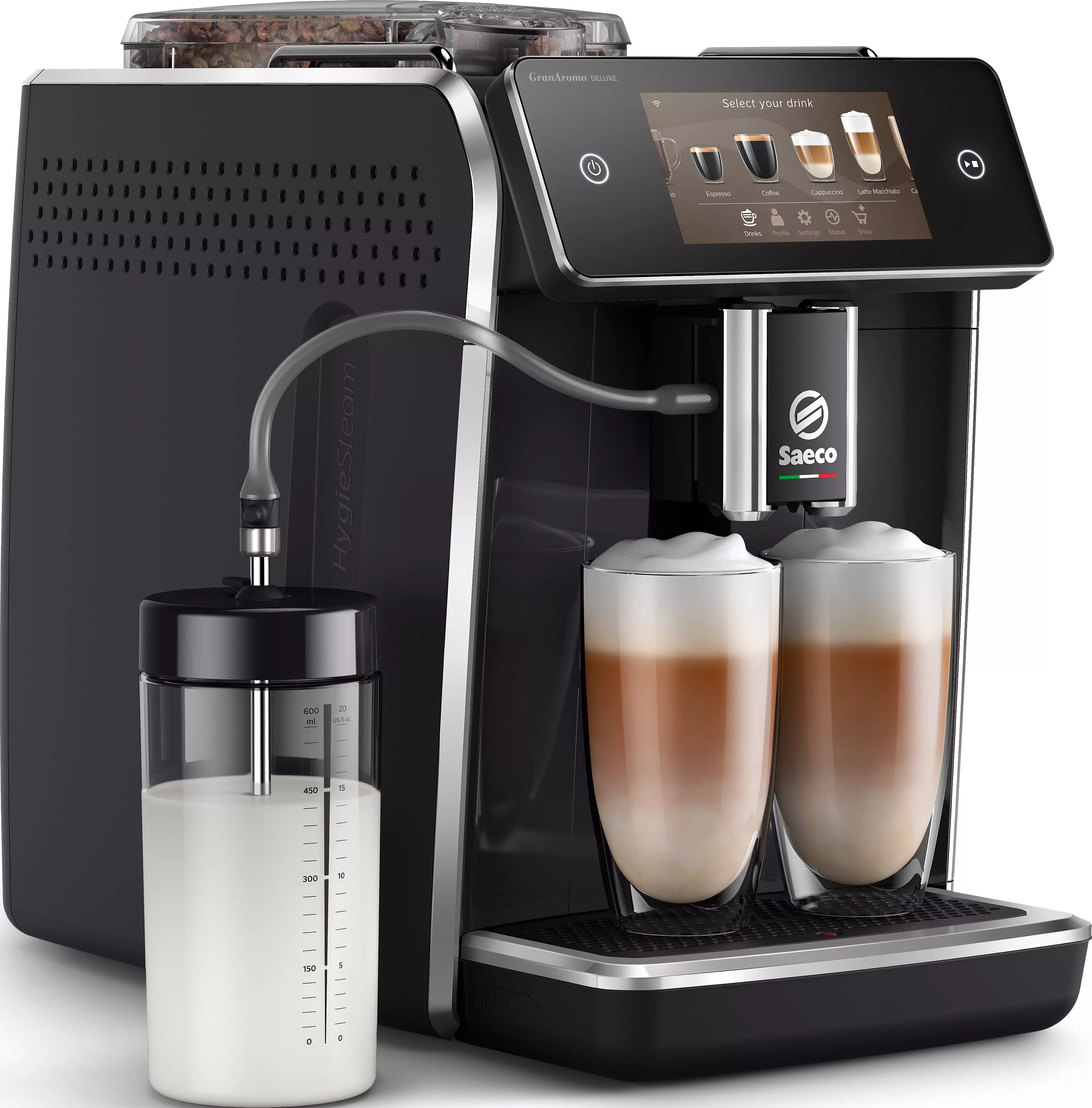 Macchina da caffè con contenitore latte, schermo mostra opzioni bevande, due bicchieri latte sotto i beccucci.