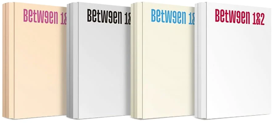 Négy könyv gerince. Címek: 'Between 1&', 'Between 1&', 'Between 1&', 'Between 1&2'. Színek: rózsaszín, fekete, kék és piros.