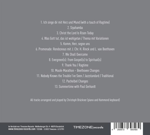 Rückseite einer CD-Hülle mit Titelliste und Text.