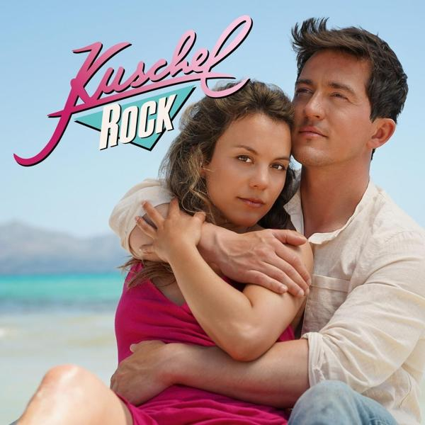 Albumcover von 'Kuschelrock'. Ein Paar umarmt sich am Strand, klarer blauer Himmel.