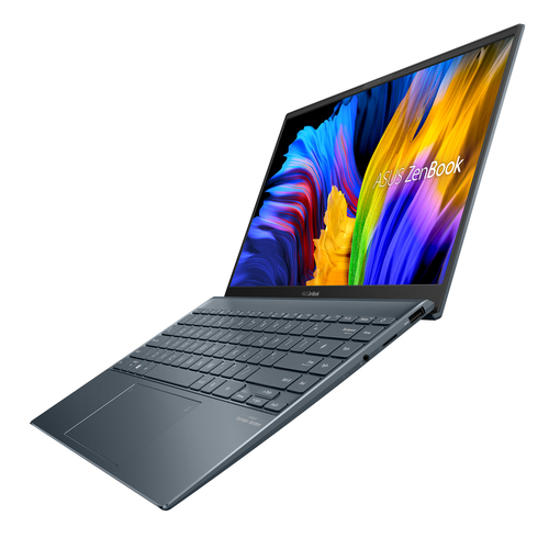 Un portátil azul está abierto, con una pantalla colorida y el logotipo de ASUS Zenbook.